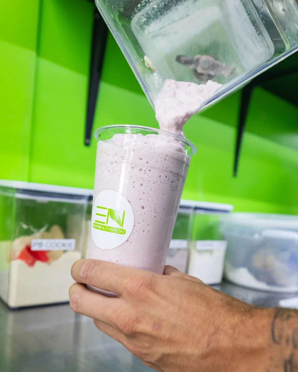 Fresh protein smoothie being poured at the Elite Nutrition Smoothie Bar
